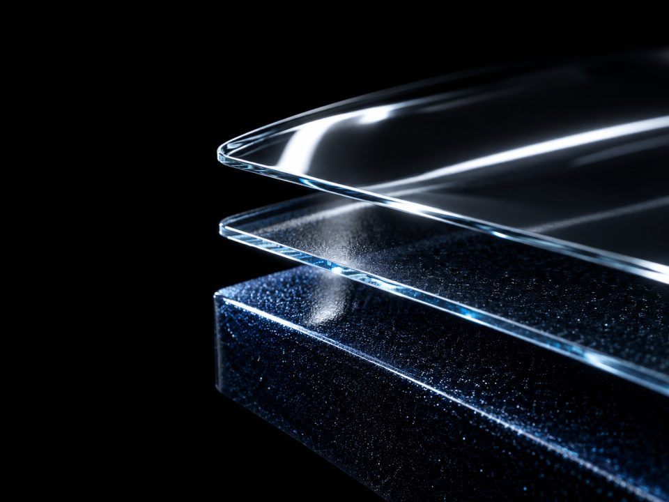 Cut-away illustration of a car's finish in three layers: paint, factory clear, and ceramic coating or applied clear coat on top